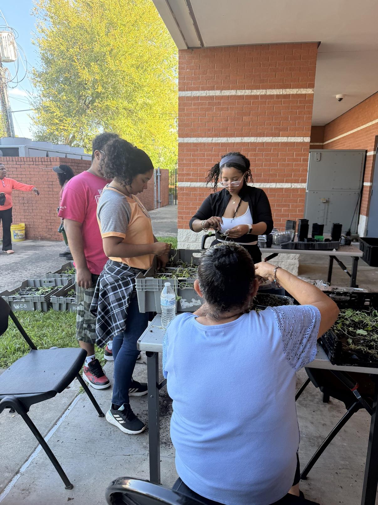 A garden-crawl class circle gathered outdoors