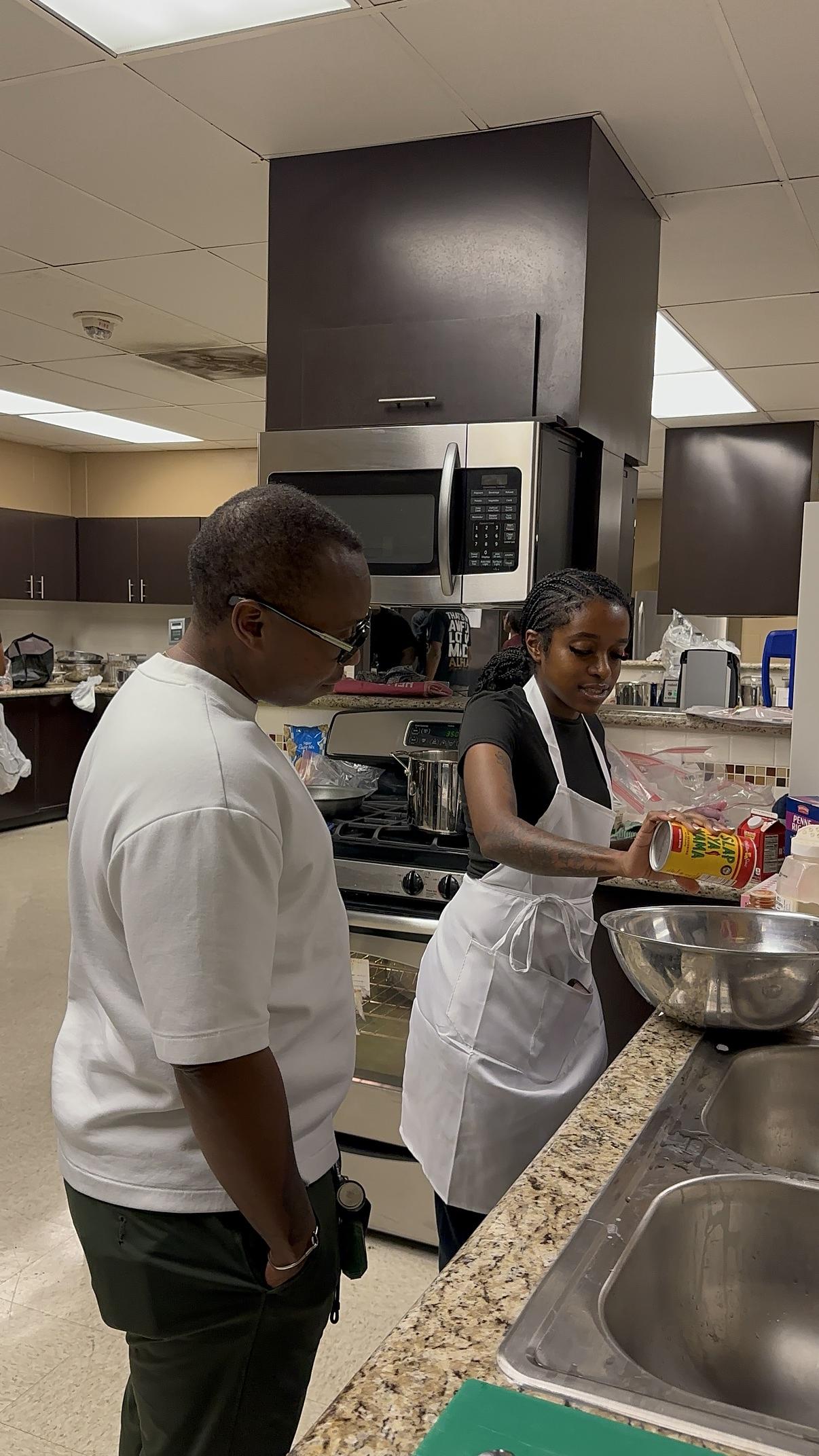 Students cooking in a VK teaching kitchen